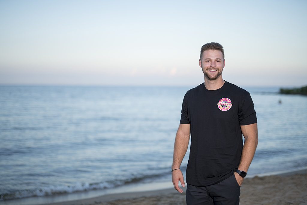Black Hilltop logo T-shirt worn outdoors